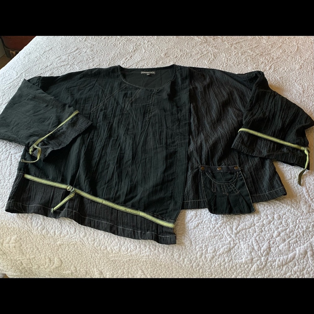 Short Neslay pullover top.Note details pocket, green trim on sleeves and bottom.